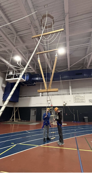 Miles Khan ’26 and Anderson Yee ’26 preparing to climb the Vertical PlayPen in their Sophomore Co-op class. 